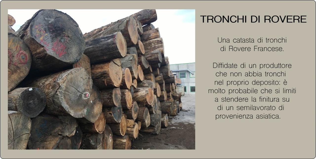 tronchi ad essiccare in piazzale 